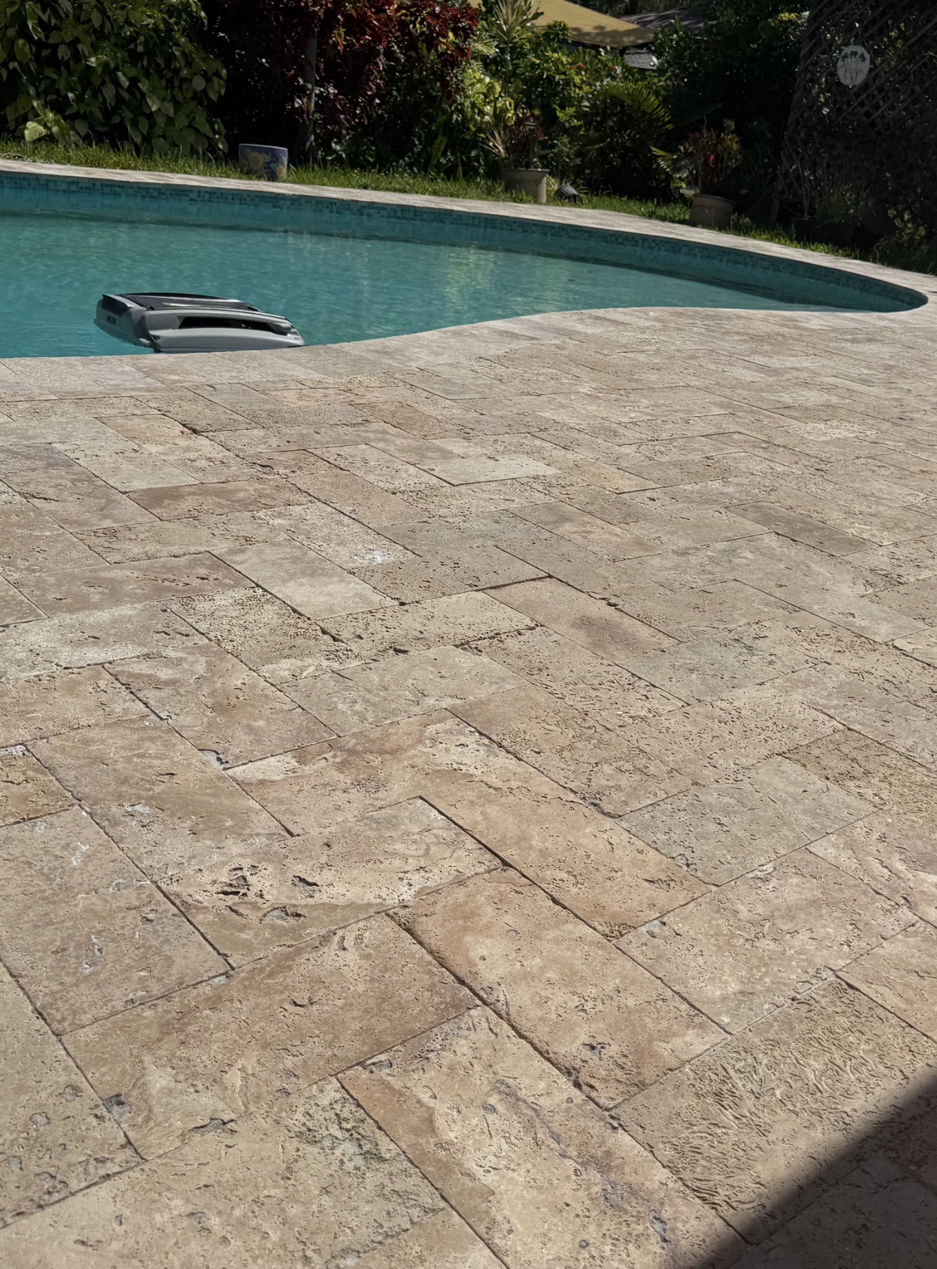 Restored and sealed travertine patio walkway